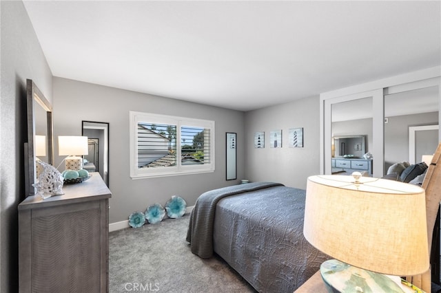 bedroom featuring baseboards and carpet flooring