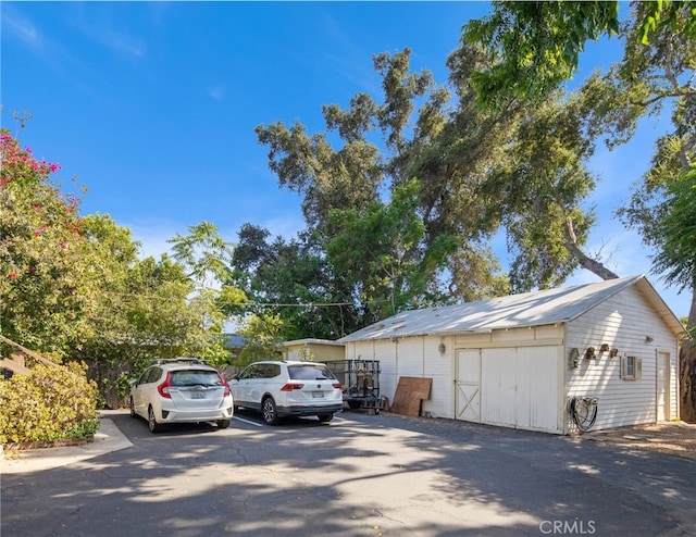 view of property exterior with a storage shed