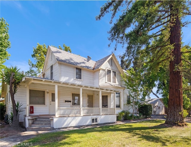 view of front of home with a front lawn and a porch