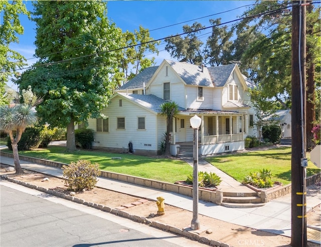 view of front of property with a front lawn and a porch