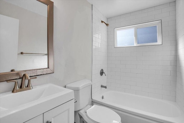 full bathroom featuring vanity, toilet, and tiled shower / bath combo