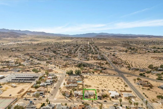 birds eye view of property with a mountain view