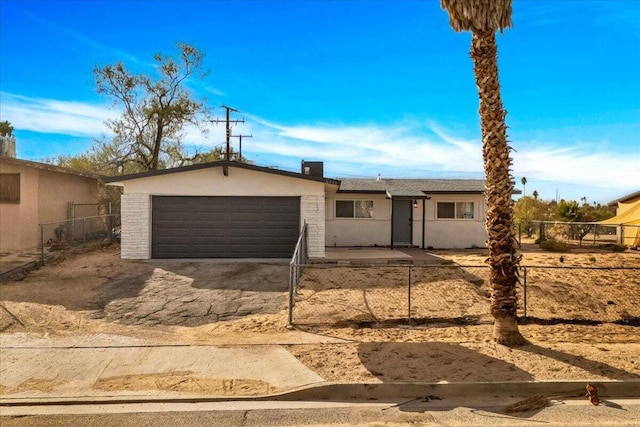 single story home with a garage