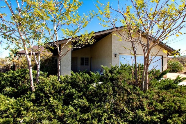 view of side of property with a garage