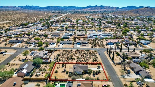 drone / aerial view featuring a mountain view