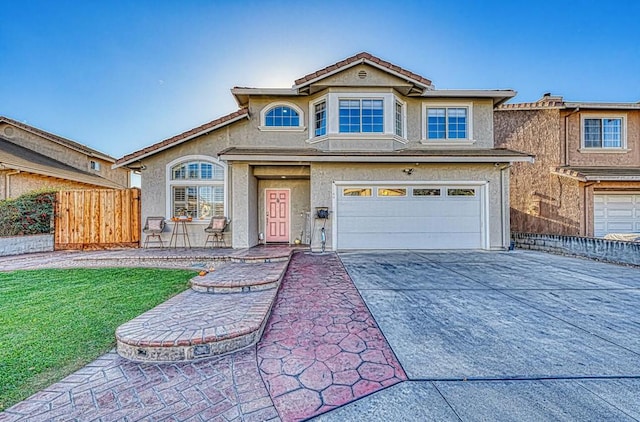 view of front of home featuring a garage and a front yard