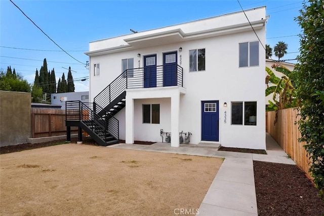 rear view of house with a patio