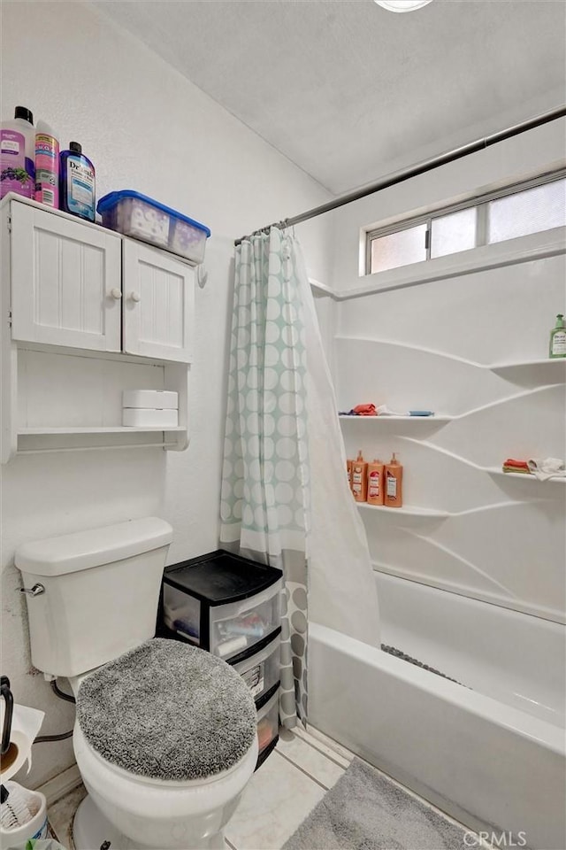 bathroom with toilet and shower / tub combo with curtain