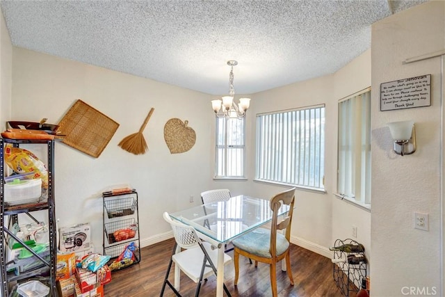 918 Summerfield St, Hemet, CA 92545 - dining room featuring dark wood-style flooring, a chandelier, and a textured ceiling