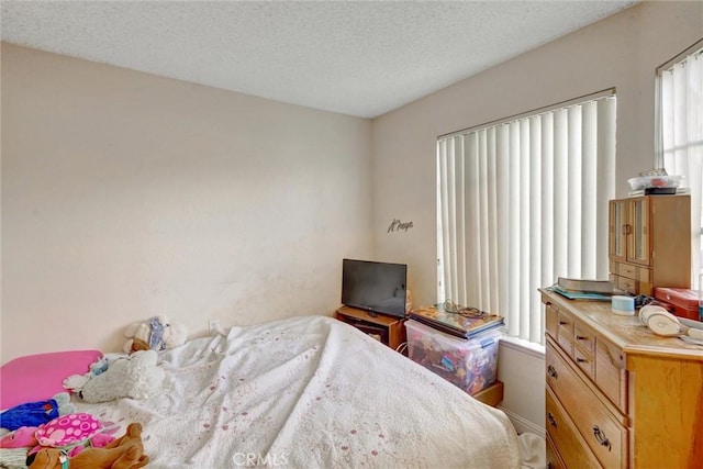 bedroom featuring a textured ceiling