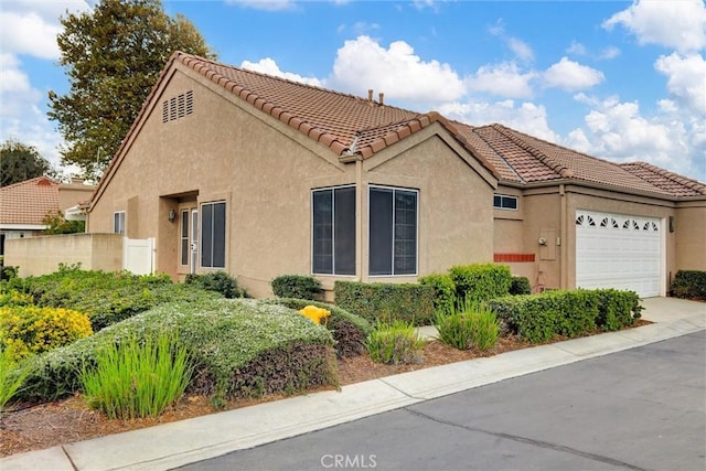 view of front of home with a garage