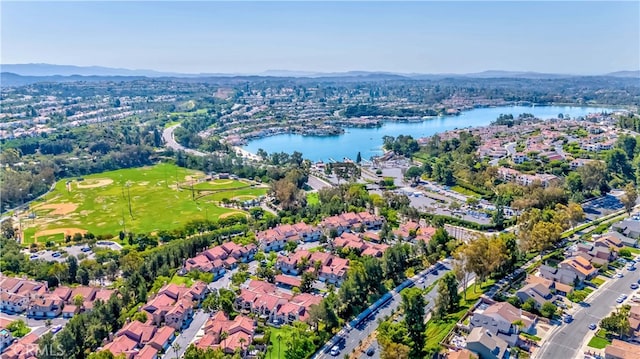 drone / aerial view featuring a water and mountain view