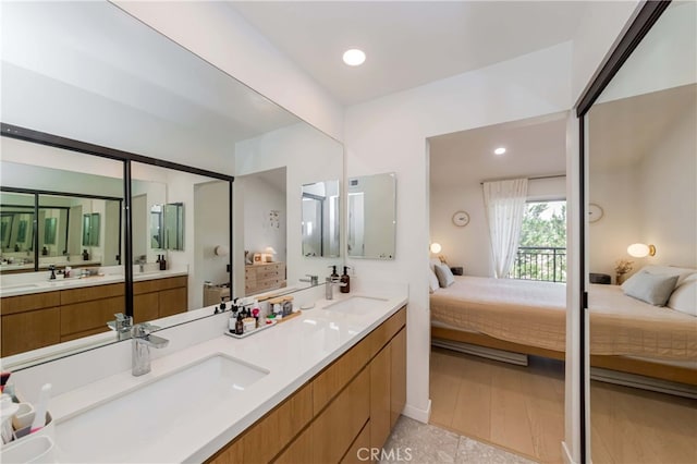 bathroom with vanity and hardwood / wood-style flooring