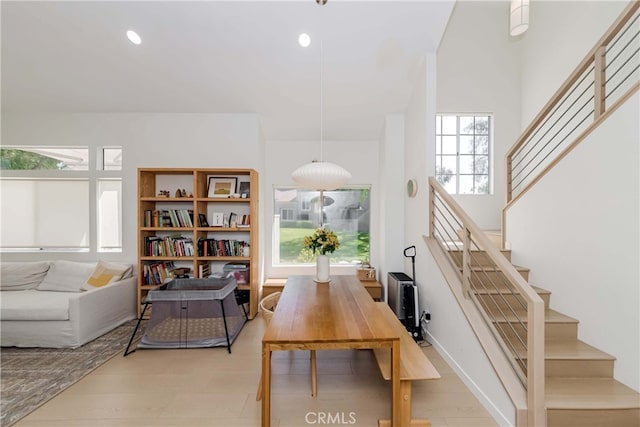 dining room featuring light wood-type flooring and plenty of natural light