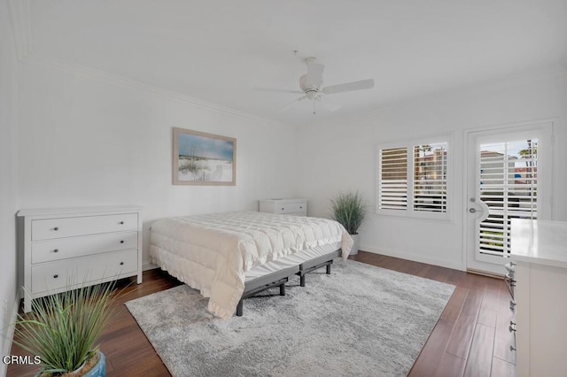 bedroom featuring access to outside, ceiling fan, and dark wood-type flooring