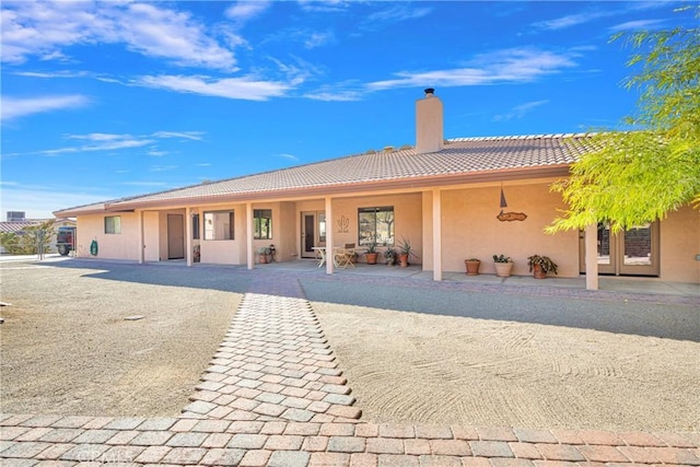 rear view of property with a patio area