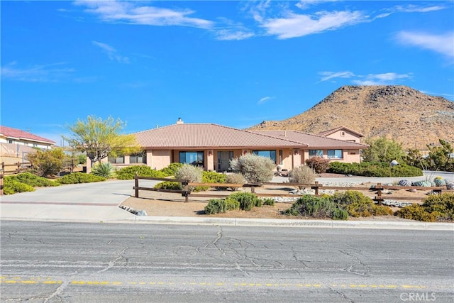 single story home with a mountain view