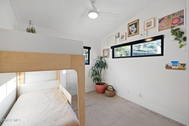 carpeted bedroom with ceiling fan and lofted ceiling