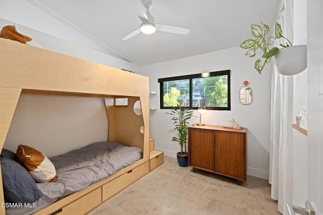 bedroom featuring ceiling fan, light colored carpet, and lofted ceiling