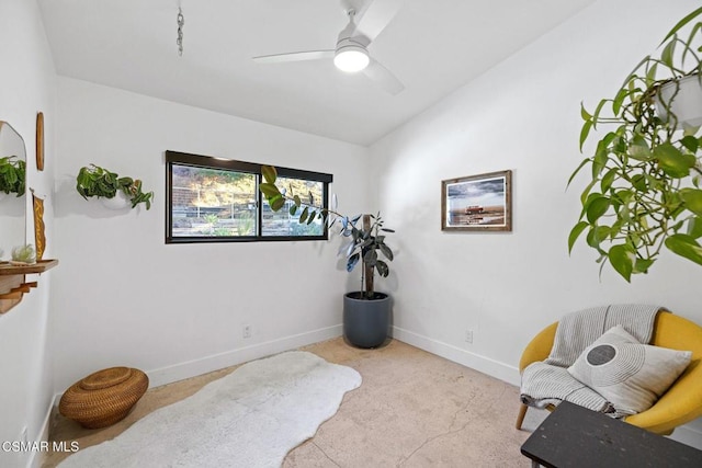 sitting room featuring ceiling fan and light carpet