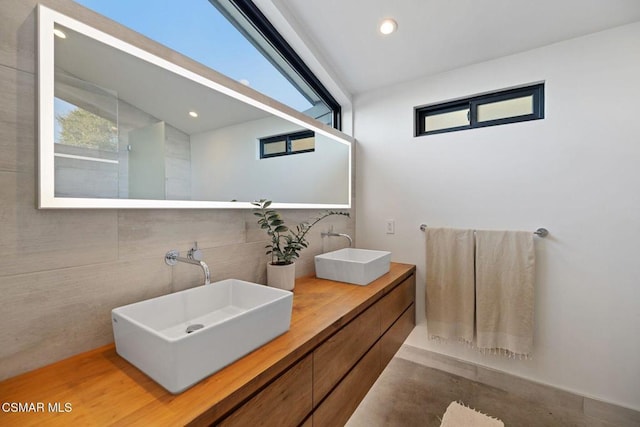 bathroom featuring vanity and concrete flooring