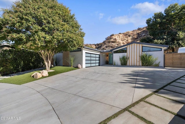 view of front facade featuring a mountain view and a garage