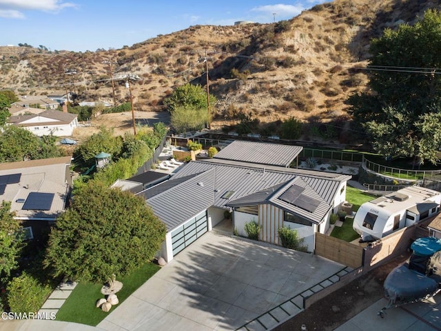 birds eye view of property with a mountain view