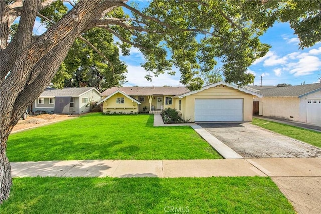 ranch-style house with a garage and a front lawn