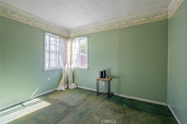 carpeted empty room with a textured ceiling