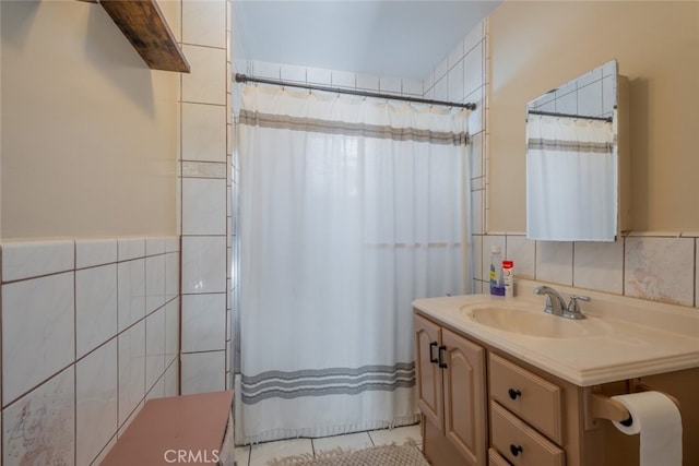 bathroom featuring tile walls and vanity