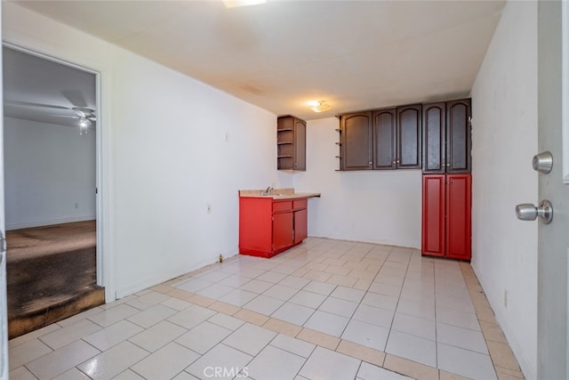 kitchen featuring ceiling fan and light tile patterned floors