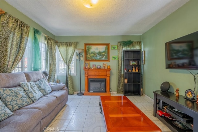 tiled living room featuring a textured ceiling