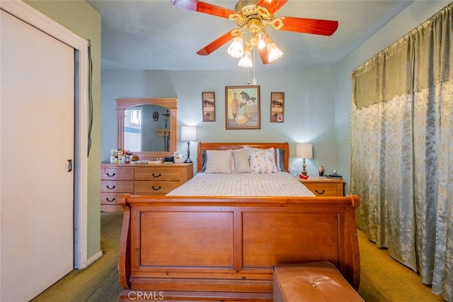 bedroom with ceiling fan and carpet