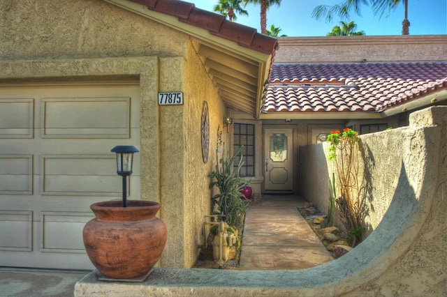 entrance to property featuring a garage