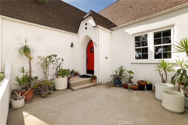 entrance to property with a patio