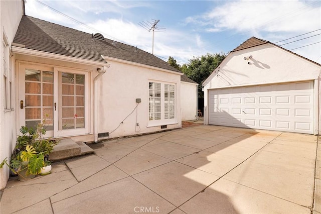 view of home's exterior with an outbuilding and a garage