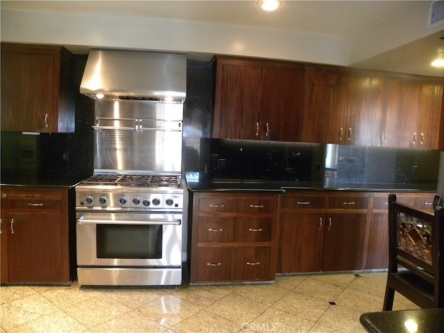 kitchen featuring backsplash, high end stainless steel range, wall chimney exhaust hood, and dark brown cabinets