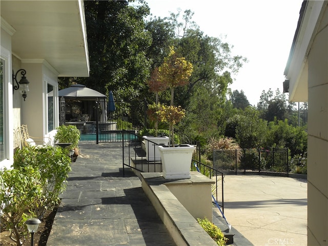 view of patio / terrace with a fenced in pool