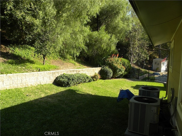 view of yard featuring central air condition unit