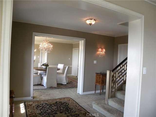 dining space featuring ornamental molding, an inviting chandelier, and carpet floors