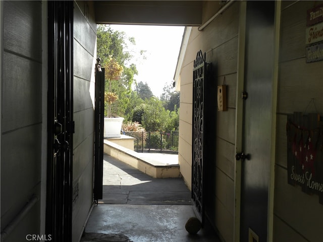 entryway featuring concrete floors and a wealth of natural light