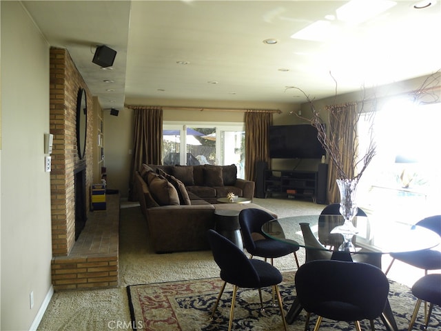 carpeted living room with a fireplace