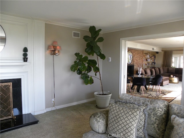 carpeted living room with ornamental molding