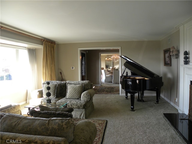 living room featuring light carpet, ornamental molding, and an inviting chandelier