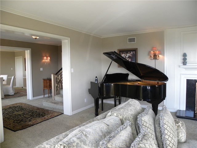 miscellaneous room with ornamental molding and carpet flooring