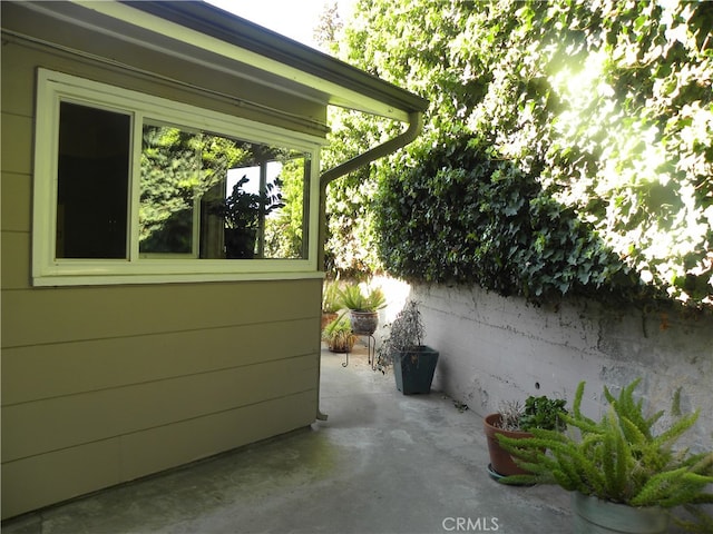 view of side of home with a patio