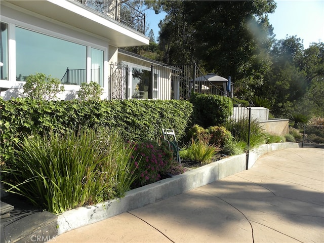 view of side of property featuring a patio area