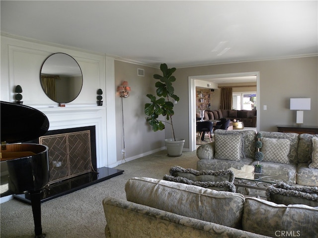 living room featuring crown molding and carpet floors