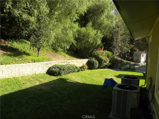 view of yard with central AC unit