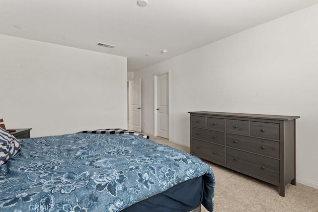 bedroom featuring light colored carpet